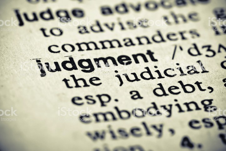 A cross processed image of the definition of "Judgment".